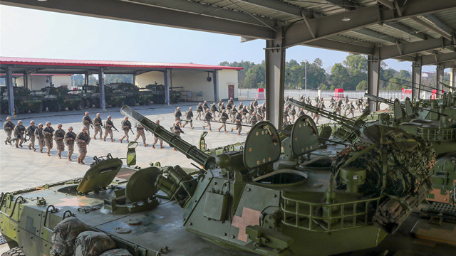 Army soldiers rush for combat readiness training exercise