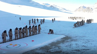 Curling game entertains troops on snowy plateau